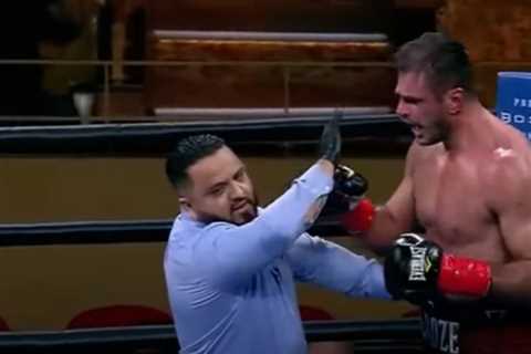 Watch heavyweight boxer PUNCH referee after being handed controversial loss which saw crowd angry..