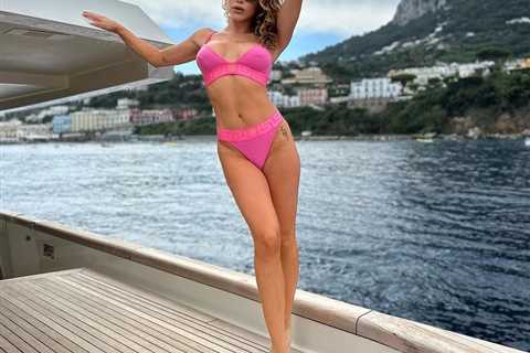 Stunning UFC ring girl Brittney Palmer shows off incredible figure in pink bikini on boat during..