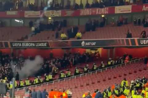 Chaos at end of Arsenal clash with PSV as away fans throw flares into home end and rip out seats as ..