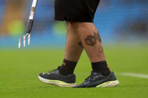 Man City groundsman shows off Man Utd tattoo on leg as he inspects pitch before Fulham clash