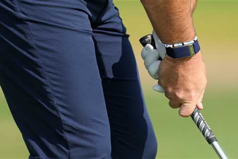 What is the correct way to hold a golf club?