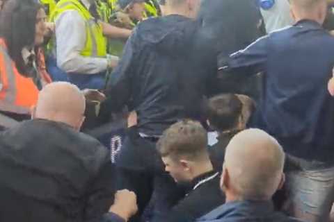 Shocking moment chaos erupts at Leeds United as fans clash with police following relegation from..