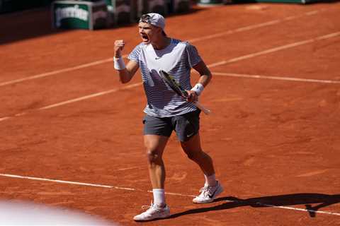 Tennis star Holger Rune labelled ‘cheat’ by fuming Roland Garros fans as he wins bizarre point..